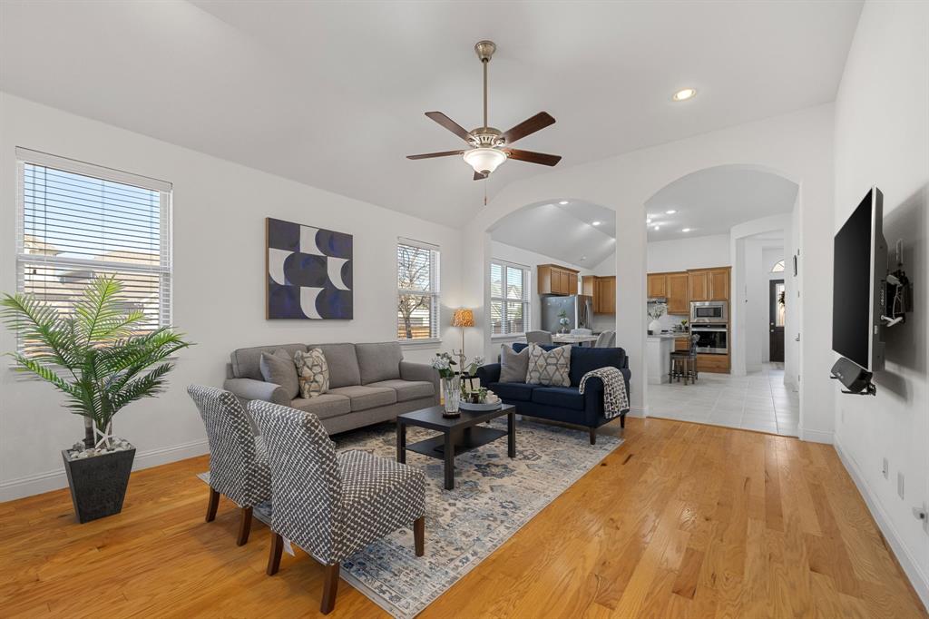 5504 Ripasso Street McKinney, TX 75070 - Photo 14 of 40 a living room with furniture and a flat screen tv