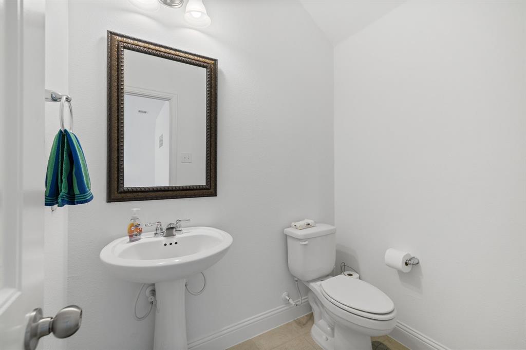 5504 Ripasso Street McKinney, TX 75070 - Photo 24 of 40 a bathroom with a toilet sink and mirror