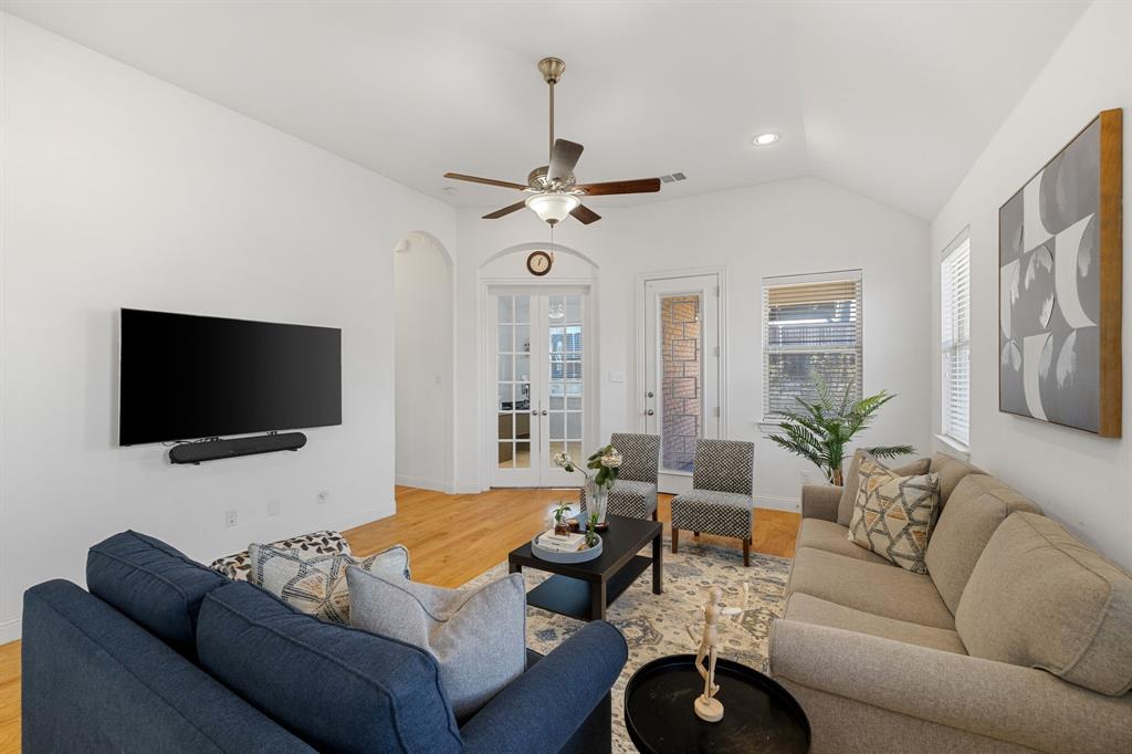 5504 Ripasso Street McKinney, TX 75070 - Photo 30 of 40 a living room with furniture and a flat screen tv