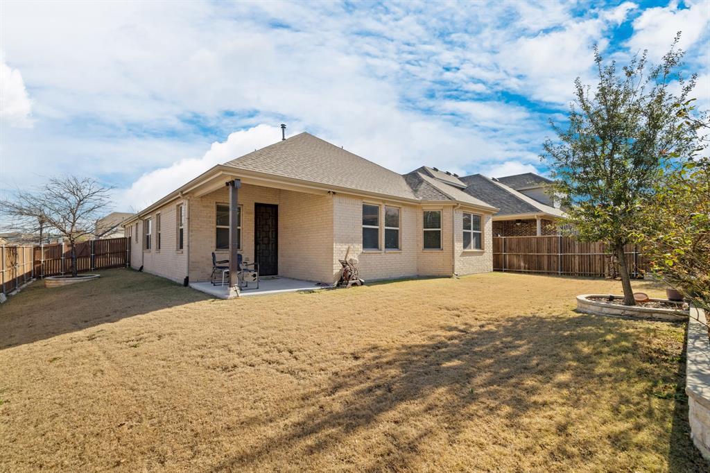 5504 Ripasso Street McKinney, TX 75070 - Photo 32 of 40 a front view of a house with a yard
