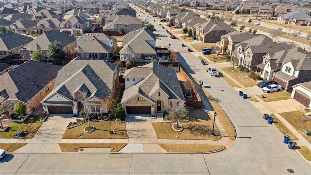 5504 Ripasso Street McKinney, TX 75070 - Photo 34 of 40 an aerial view of residential houses with outdoor space