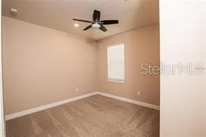 a view of an empty room with a bathroom