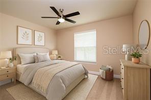 7845 Wandering Way Orlando, FL 32836 - Photo 39 of 61 a bedroom with a bed a dresser next to a window