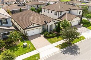 7845 Wandering Way Orlando, FL 32836 - Photo 4 of 61 an aerial view of a house with a yard and potted plants