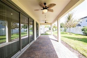 7845 Wandering Way Orlando, FL 32836 - Photo 44 of 61 a view of a porch with a floor to ceiling windows