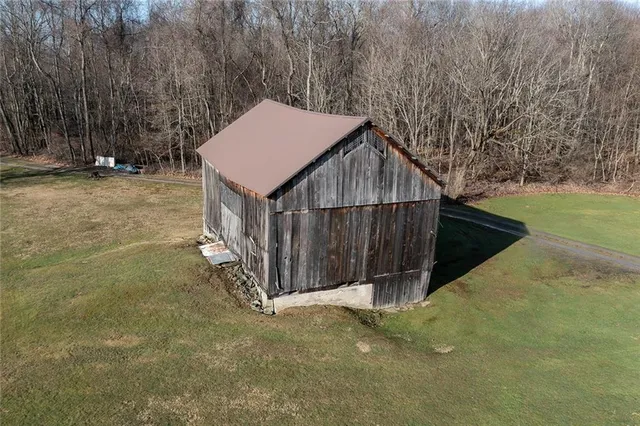a view of a house with a wooden fence