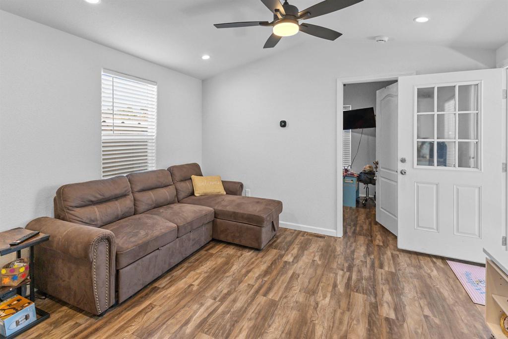 3221 Bancroft Drive, Unit 25 Spring Valley, CA 91977 - Photo 12 of 17 a living room with furniture and a window