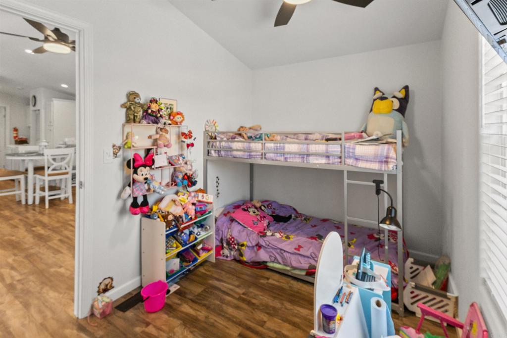 3221 Bancroft Drive, Unit 25 Spring Valley, CA 91977 - Photo 14 of 17 a bed room with a bed and a chandelier