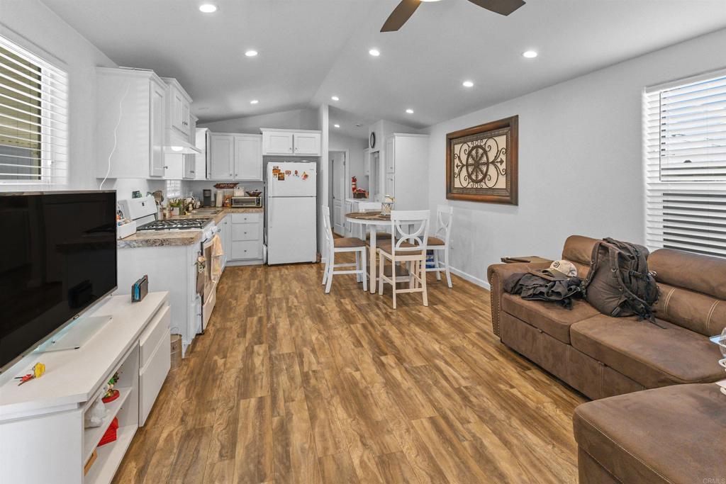 3221 Bancroft Drive, Unit 25 Spring Valley, CA 91977 - Photo 15 of 17 a living room with stainless steel appliances furniture and a flat screen tv