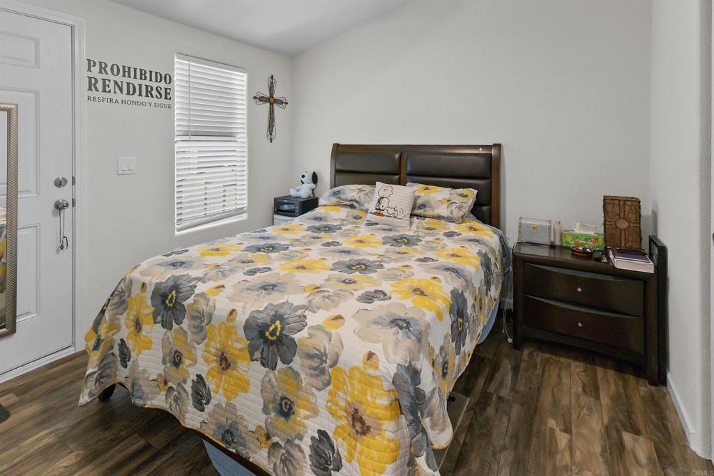3221 Bancroft Drive, Unit 25 Spring Valley, CA 91977 - Photo 10 of 17 a bedroom with a bed and window