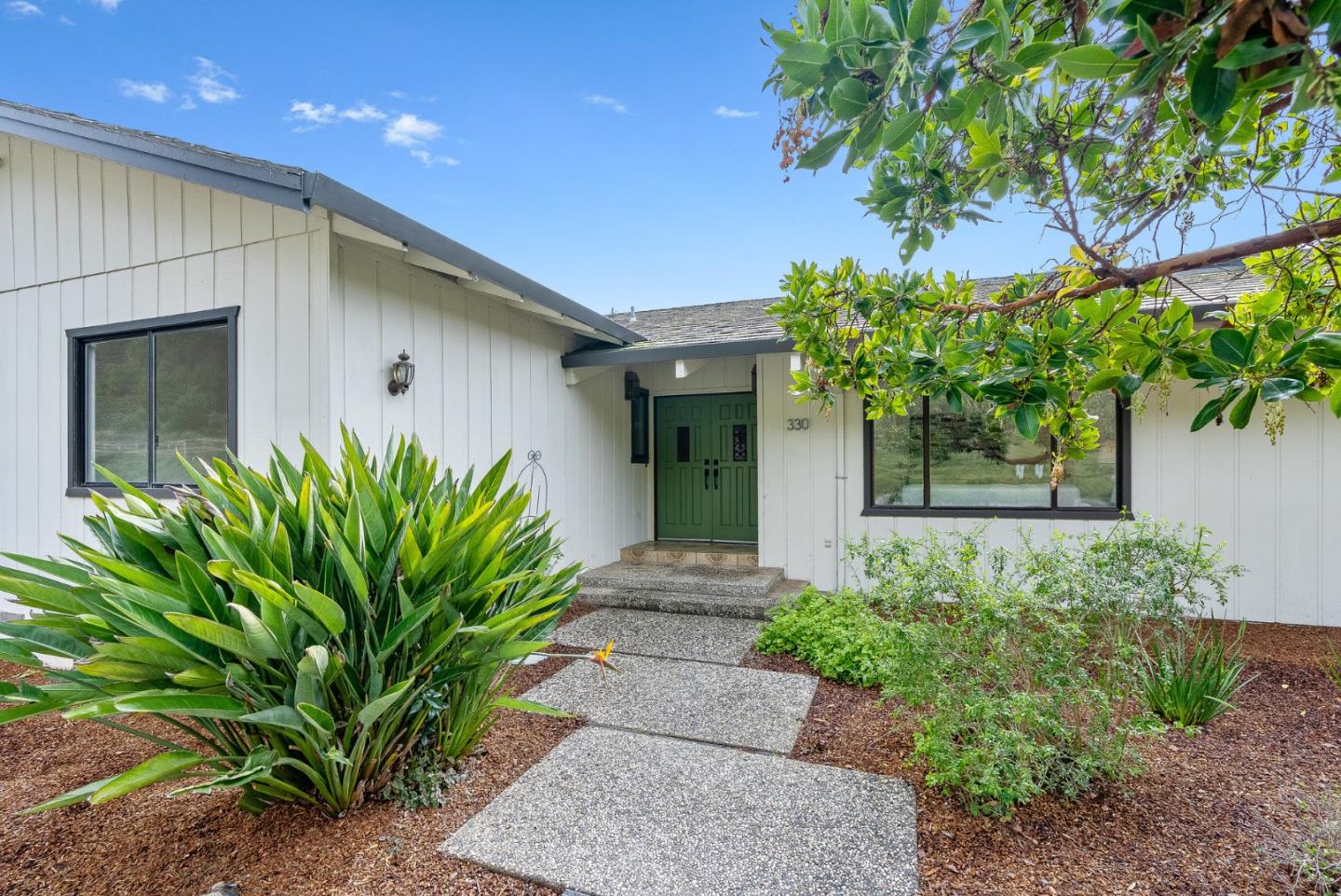330 Enos Lane Corralitos, CA 95076 - Photo 1 of 73 a front view of a house with a yard