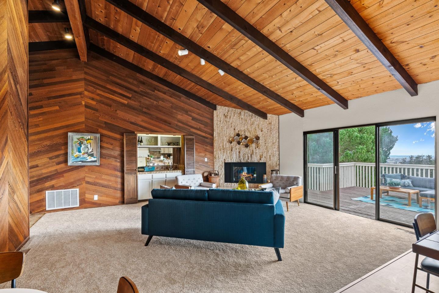 330 Enos Lane Corralitos, CA 95076 - Photo 17 of 73 a living room with furniture a fireplace and a large window