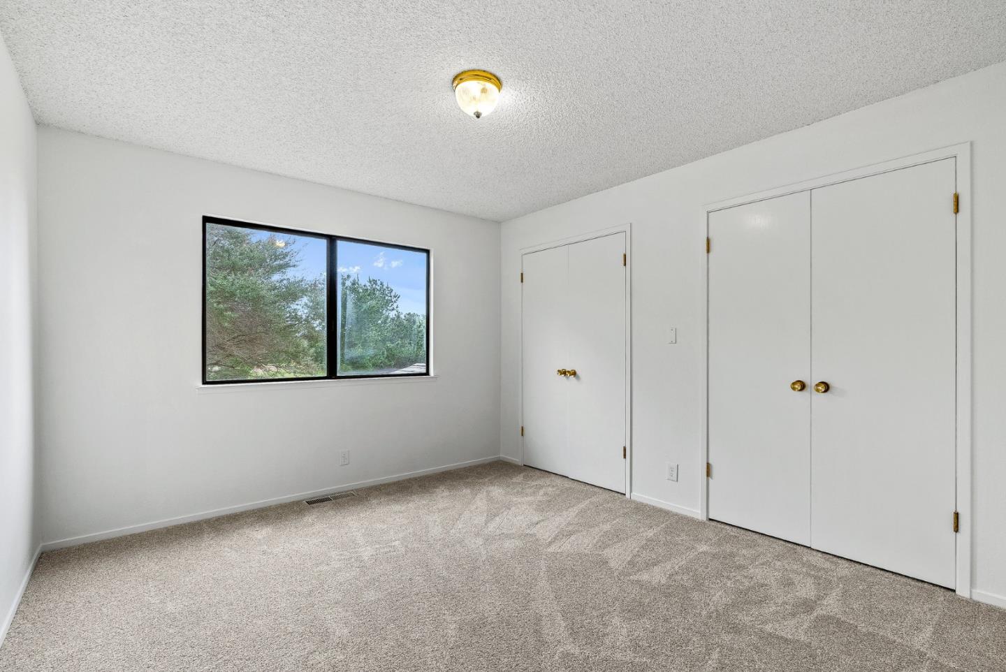 330 Enos Lane Corralitos, CA 95076 - Photo 28 of 73 a view of an empty room with window and closet