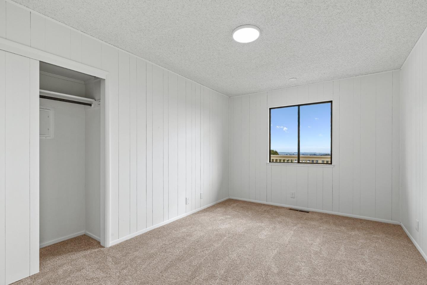 330 Enos Lane Corralitos, CA 95076 - Photo 34 of 73 a view of an empty room with a window