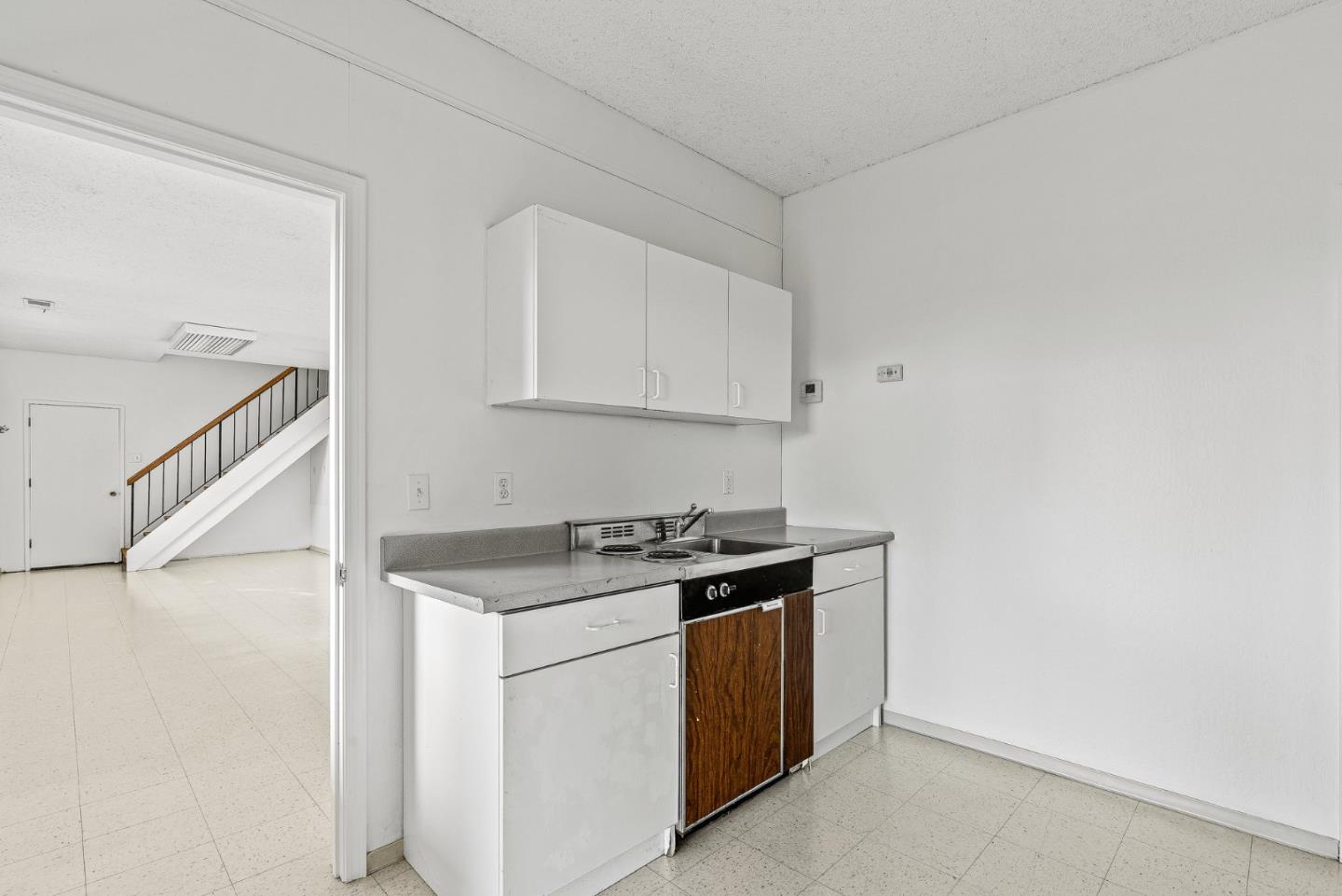 330 Enos Lane Corralitos, CA 95076 - Photo 42 of 73 a kitchen with a stove and a white cabinet