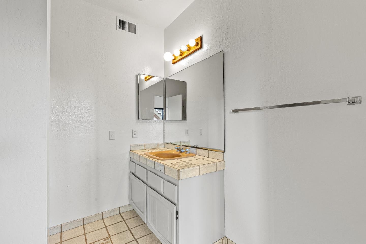 330 Enos Lane Corralitos, CA 95076 - Photo 44 of 73 a bathroom with a sink and a mirror