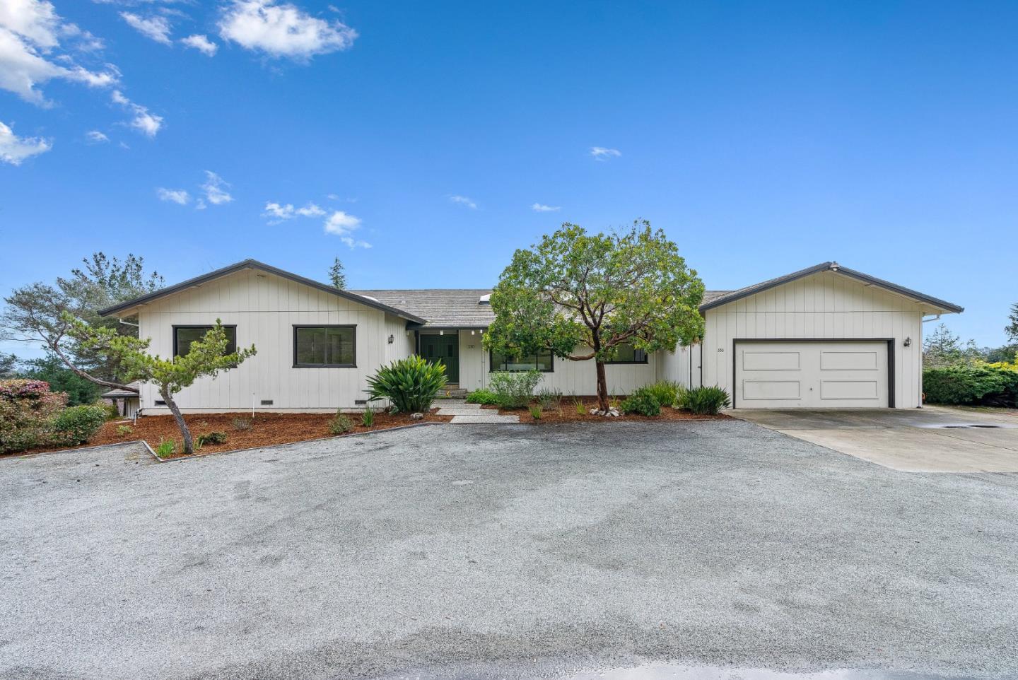 330 Enos Lane Corralitos, CA 95076 - Photo 65 of 73 a front view of a house with a yard and garage