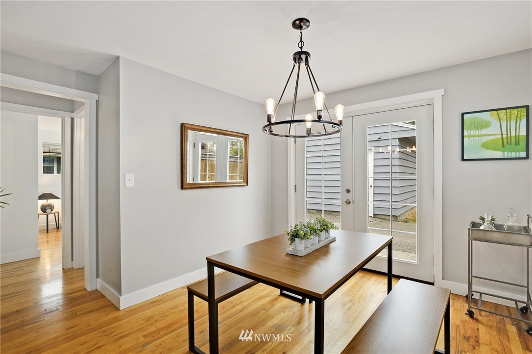 10014 40th Avenue Southwest Seattle, WA 98146 - Photo 14 of 36 a view of a room with furniture and wooden floor