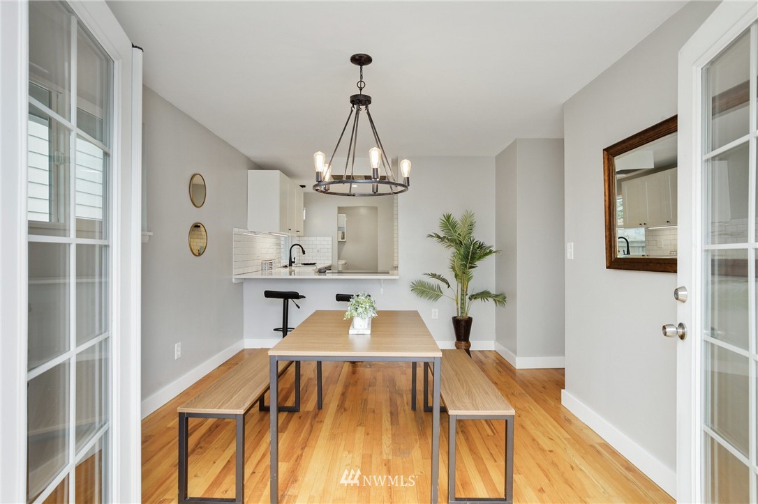 10014 40th Avenue Southwest Seattle, WA 98146 - Photo 19 of 36 a living room with furniture and a chandelier