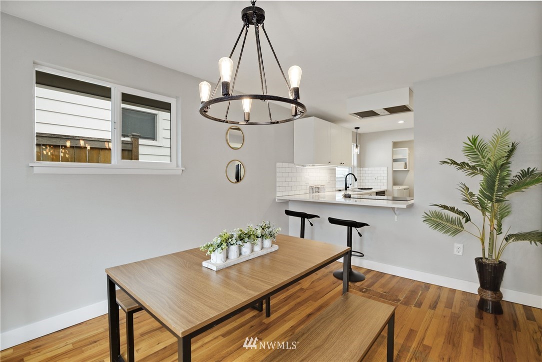10014 40th Avenue Southwest Seattle, WA 98146 - Photo 20 of 36 a view of a workspace with furniture and wooden floor