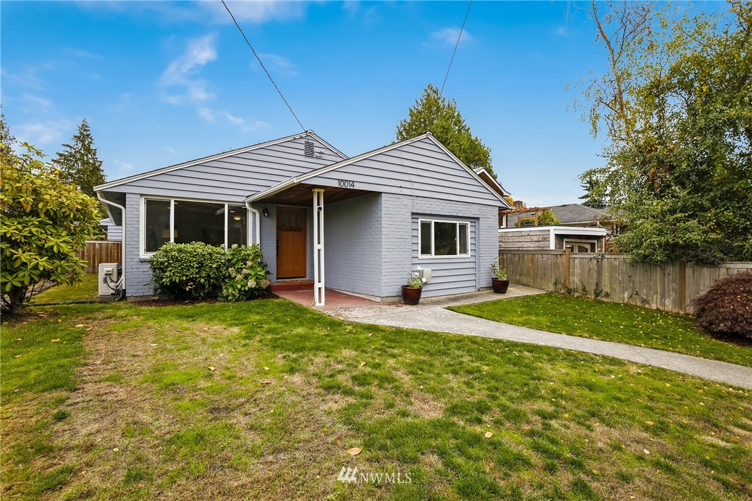 10014 40th Avenue Southwest Seattle, WA 98146 - Photo 3 of 36 a view of a house with backyard and garden