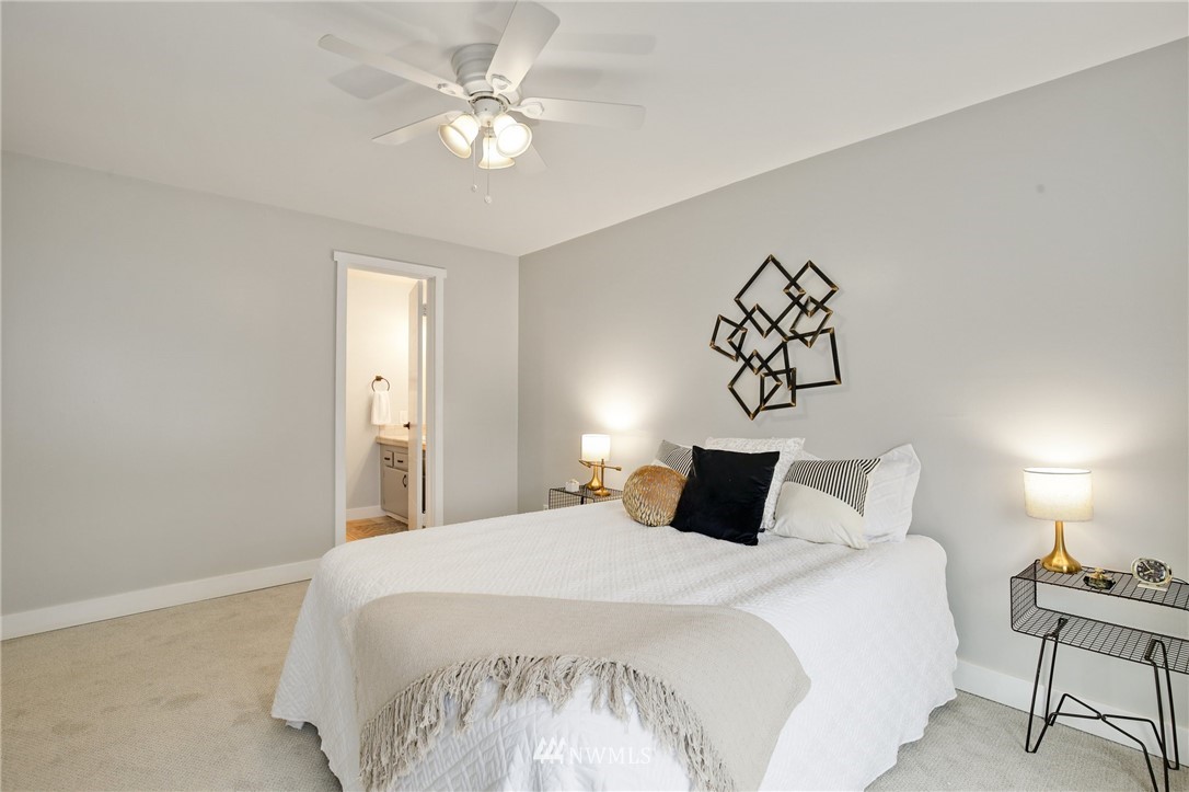 10014 40th Avenue Southwest Seattle, WA 98146 - Photo 22 of 36 a bedroom with a bed and a table