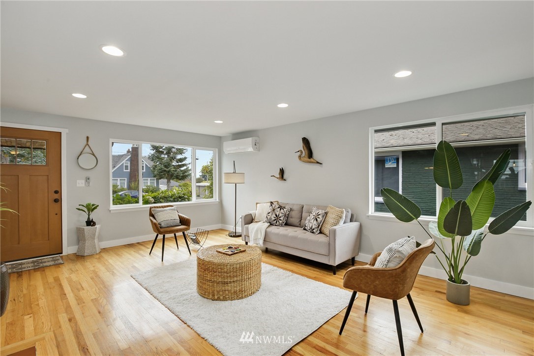 10014 40th Avenue Southwest Seattle, WA 98146 - Photo 5 of 36 a living room with furniture and a large window