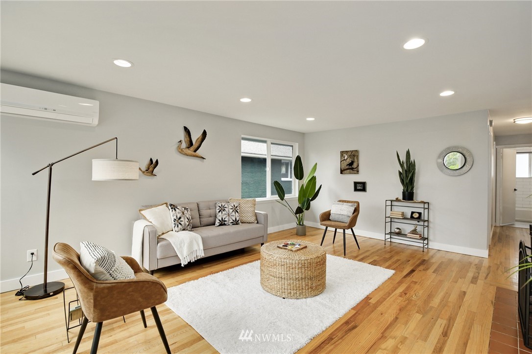 10014 40th Avenue Southwest Seattle, WA 98146 - Photo 6 of 36 a living room with furniture a couch and wooden floor
