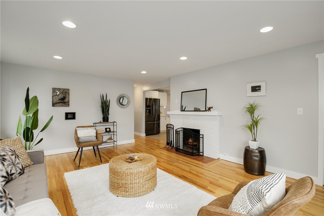 10014 40th Avenue Southwest Seattle, WA 98146 - Photo 7 of 36 a living room with furniture fireplace and a potted plant