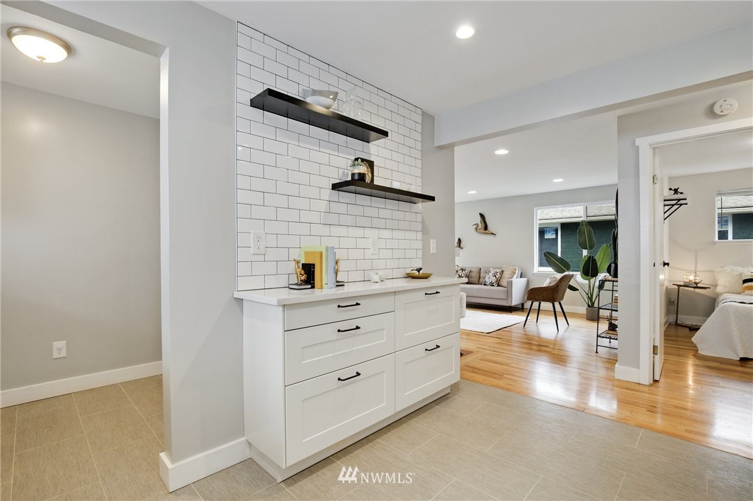 10014 40th Avenue Southwest Seattle, WA 98146 - Photo 8 of 36 a room with lots of wooden furniture and a view of living room