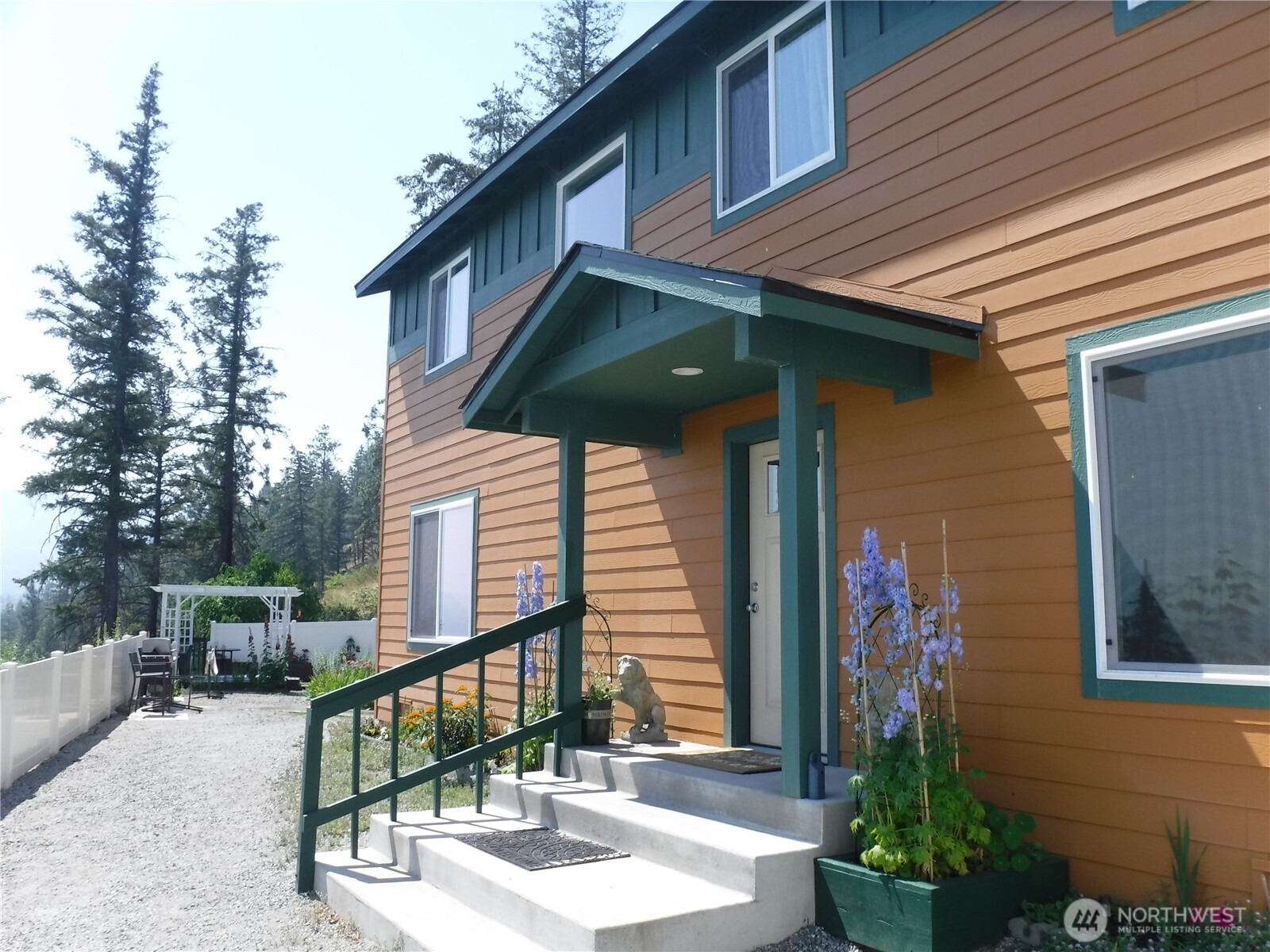 165 Granite Falls Road Chelan, WA 98816 - Photo 6 of 27 a front view of a house with garden