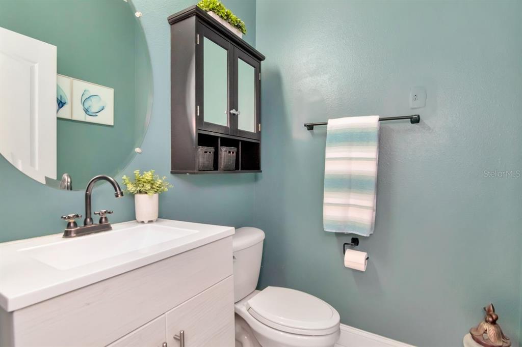 8880 Moonlit Meadows Loop Riverview, FL 33578 - Photo 14 of 43 a bathroom with a toilet sink and mirror