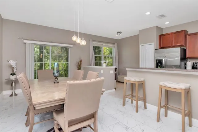 a kitchen with stainless steel appliances a refrigerator stove microwave and sink