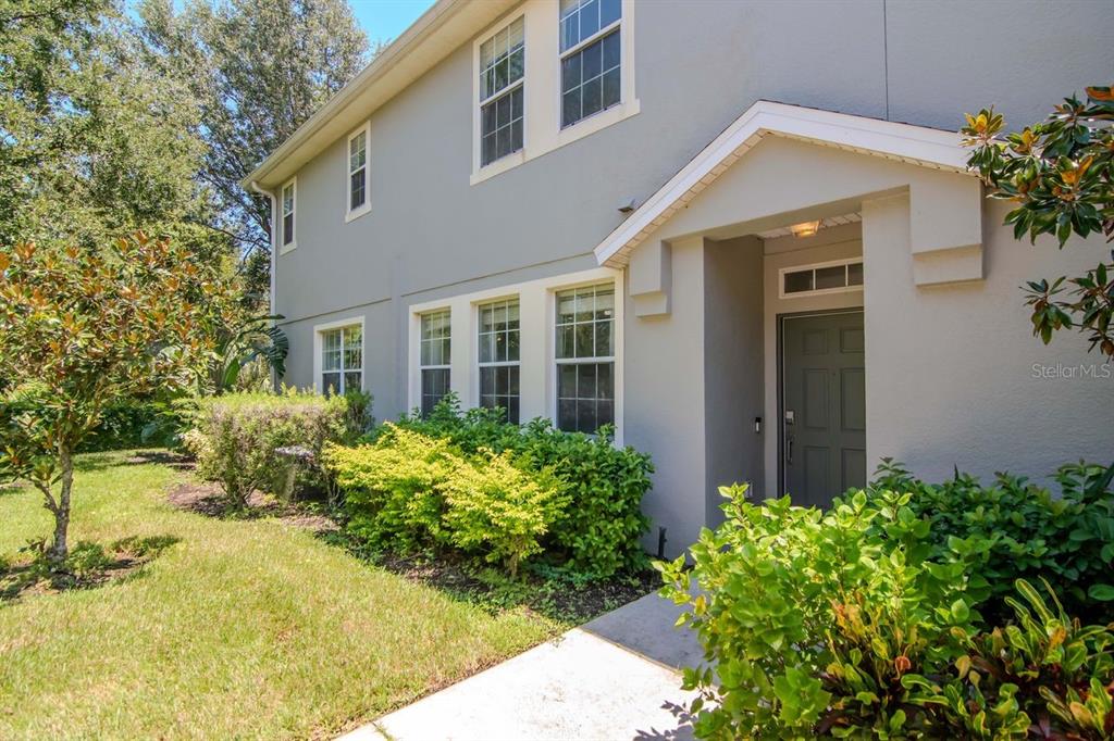 8880 Moonlit Meadows Loop Riverview, FL 33578 - Photo 2 of 43 a front view of a house with garden