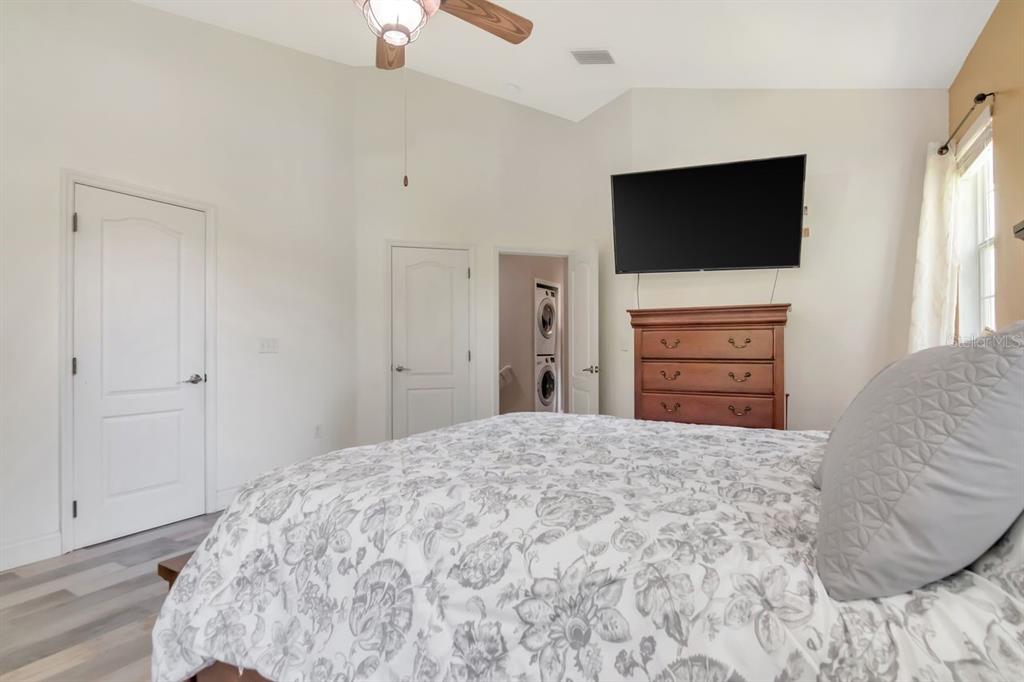 8880 Moonlit Meadows Loop Riverview, FL 33578 - Photo 22 of 43 a bedroom with a bed and a flat screen tv