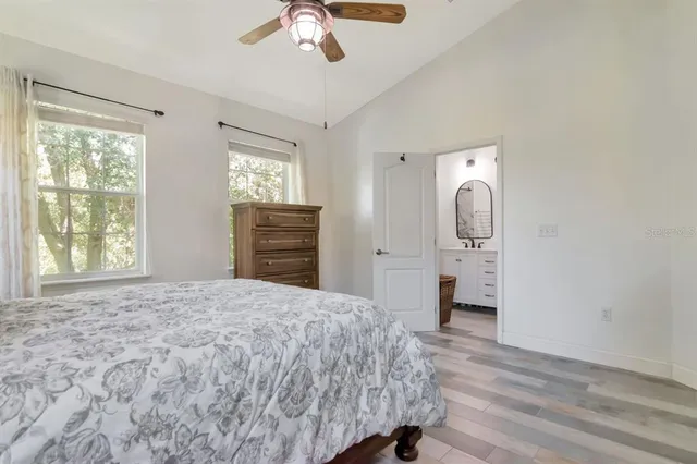 a bathroom with a double vanity sink mirror and