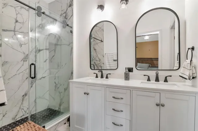 a bathroom with a sink and mirror