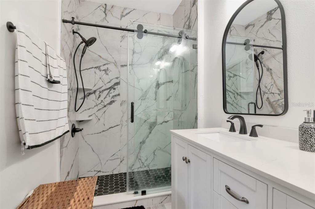 8880 Moonlit Meadows Loop Riverview, FL 33578 - Photo 25 of 43 a bathroom with a sink and mirror