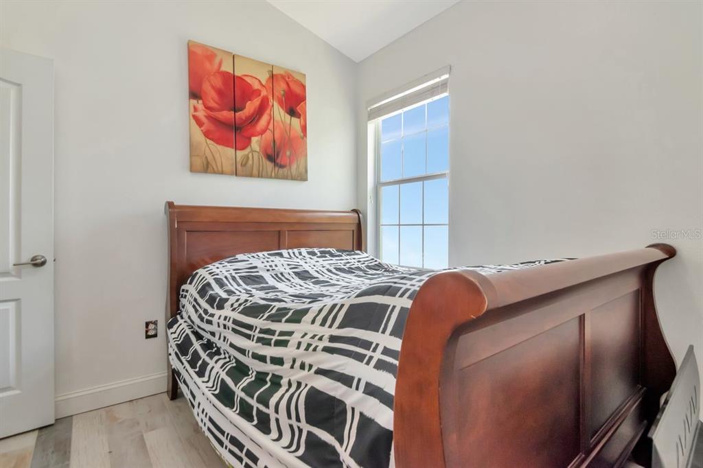 8880 Moonlit Meadows Loop Riverview, FL 33578 - Photo 28 of 43 a bedroom with a bed and a painting on the wall