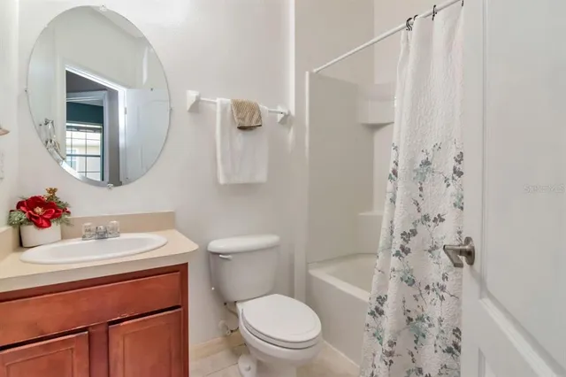 a bedroom with a bed and flat screen tv