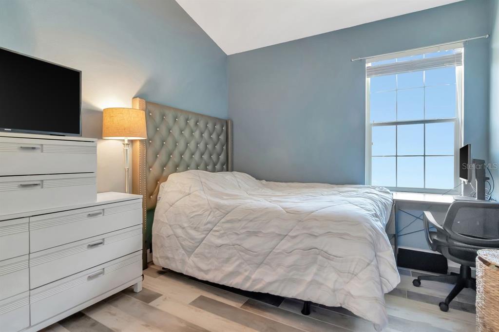 8880 Moonlit Meadows Loop Riverview, FL 33578 - Photo 30 of 43 a bedroom with a bed and flat screen tv