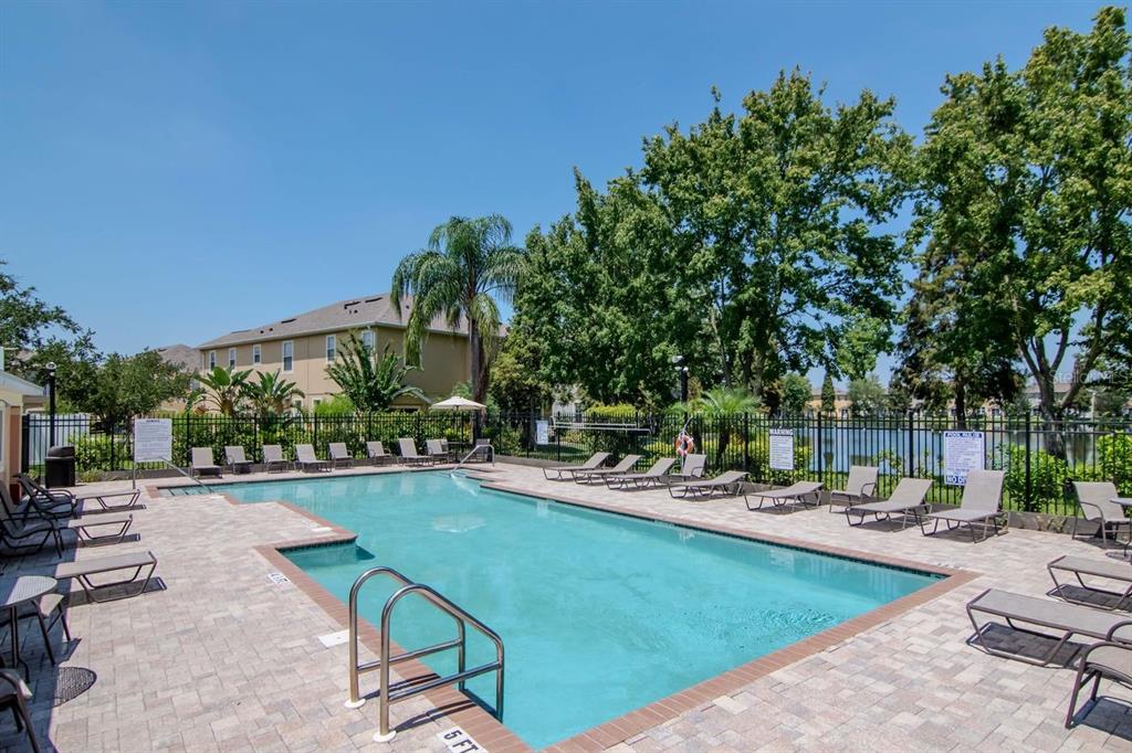 8880 Moonlit Meadows Loop Riverview, FL 33578 - Photo 32 of 43 a swimming pool with outdoor seating and yard