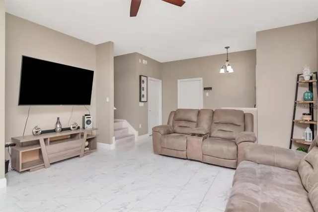 a living room with furniture and windows