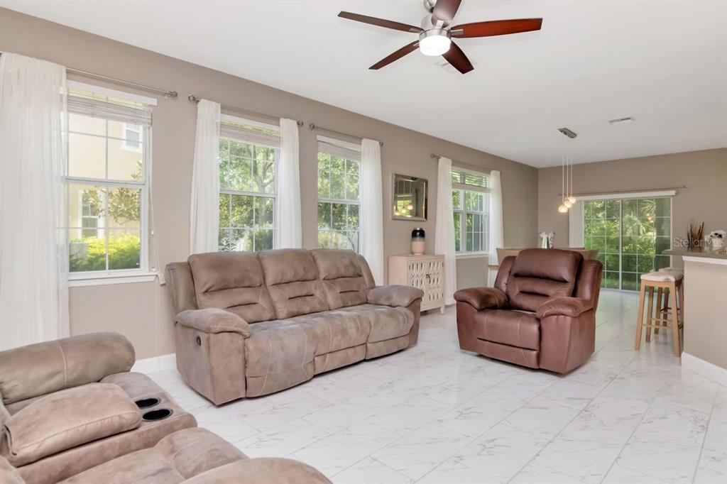 8880 Moonlit Meadows Loop Riverview, FL 33578 - Photo 9 of 43 a living room with furniture and windows