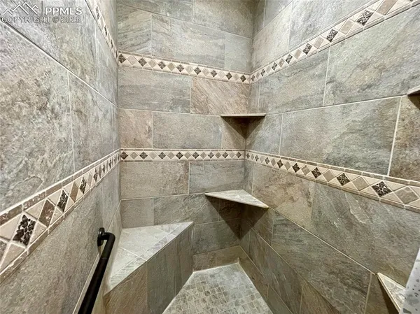 a bathroom with a bathtub and shower