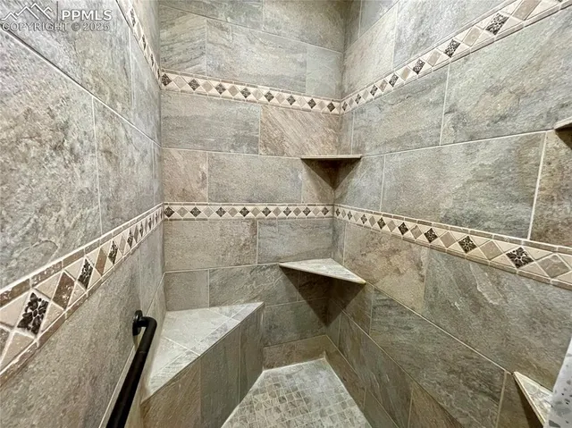 a bathroom with a bathtub and shower