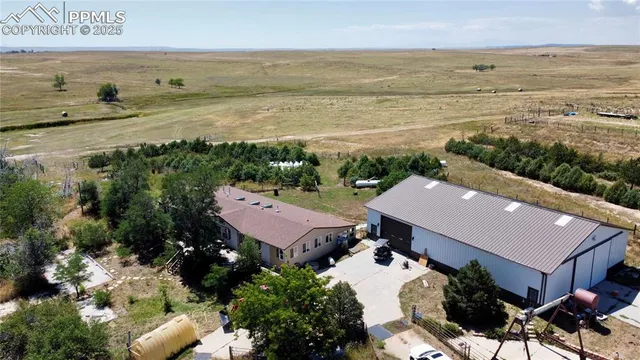 an aerial view of a house with a outdoor space