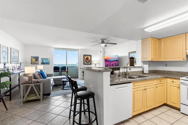 a kitchen with cabinets a sink and appliances