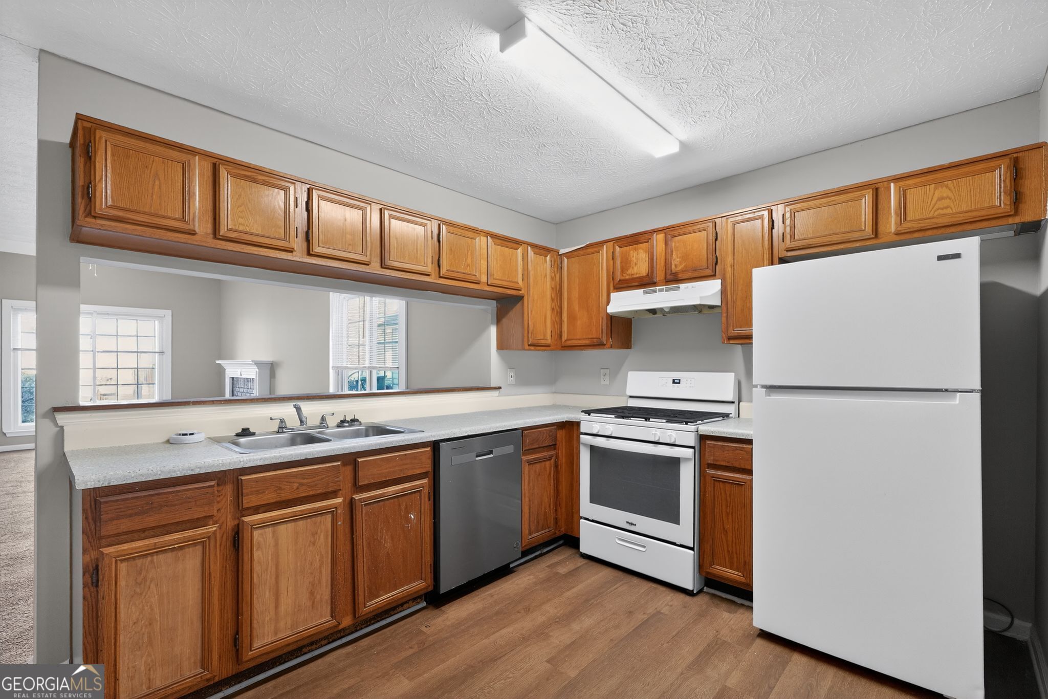 3751 Oakwood Manor Court Decatur, GA 30032 - Photo 20 of 33 a kitchen with stainless steel appliances granite countertop a refrigerator and a sink