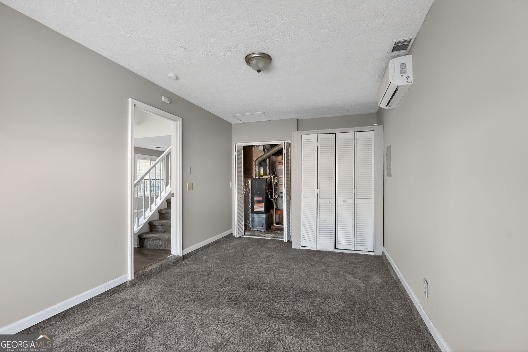 3751 Oakwood Manor Court Decatur, GA 30032 - Photo 28 of 33 a view of an empty room with closet and a window